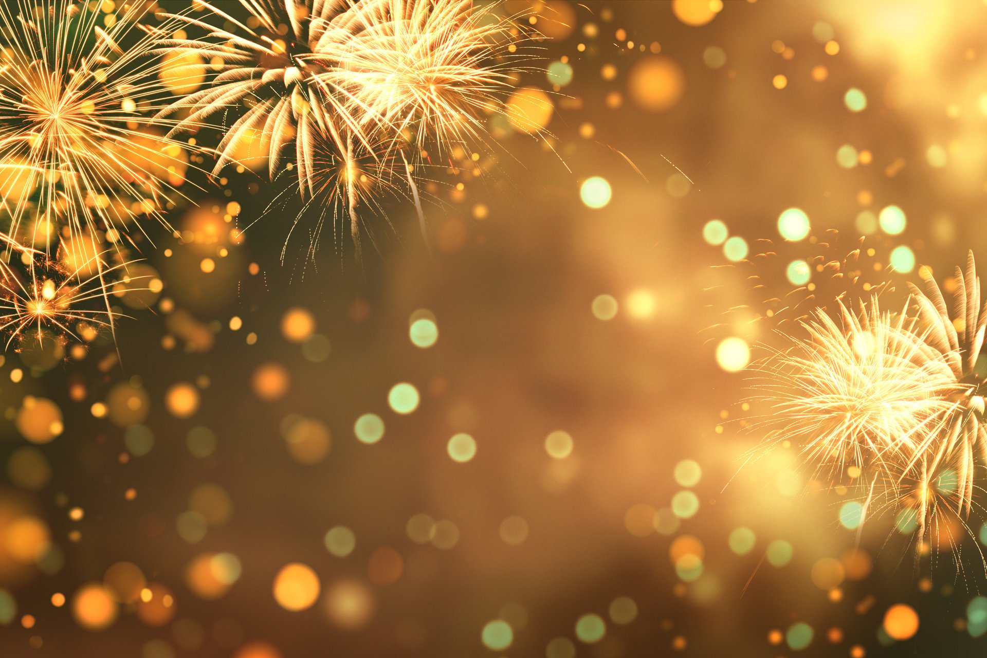 Fireworks and golden bokeh lights, festive background for New Year celebration, holiday event, Christmas or festival concept